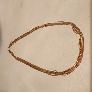 Multi-strand gold toned necklace